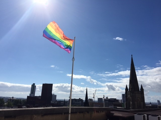 Pride Flag against a blue sky